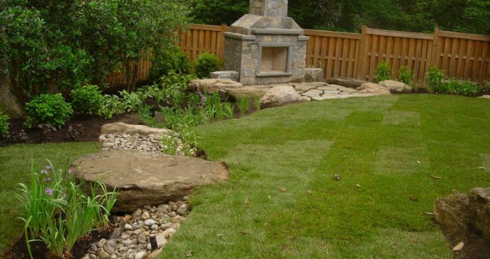 Dry stream bed leading to stone fireplace