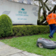 Workers using electric lawn care equipment