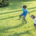 Kids playing on healthy lawn in summer