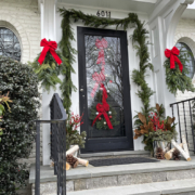 Front door entryway with holiday decorations by Shorb Landscaping.