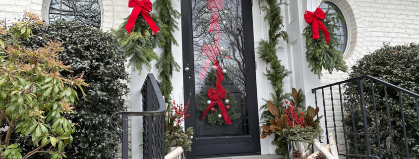 Front door entryway with holiday decorations by Shorb Landscaping.